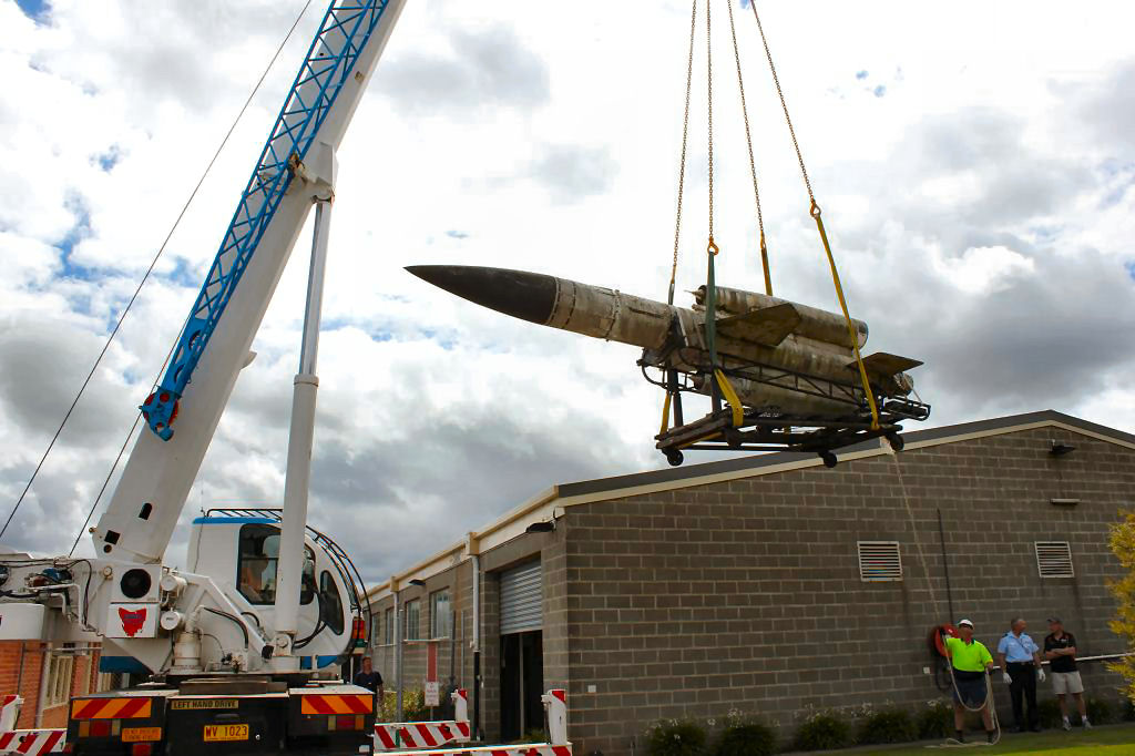 Loading Bloodhound onto float at Scottsdale, Tas.